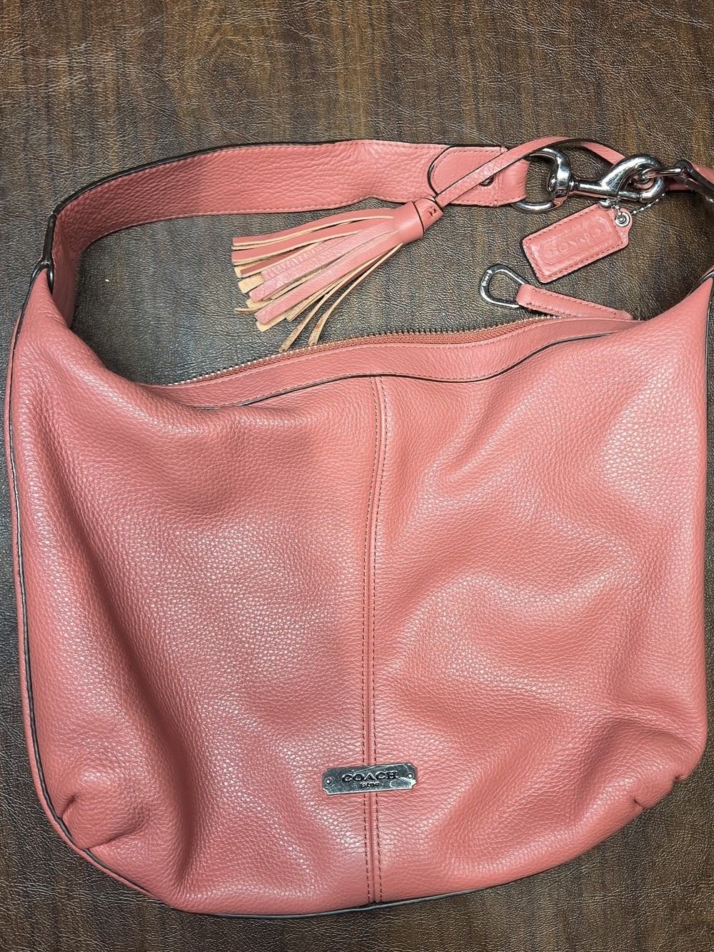 Coach Coral-Peach Pebbled Leather Shoulder Hobo with Tassel Charm